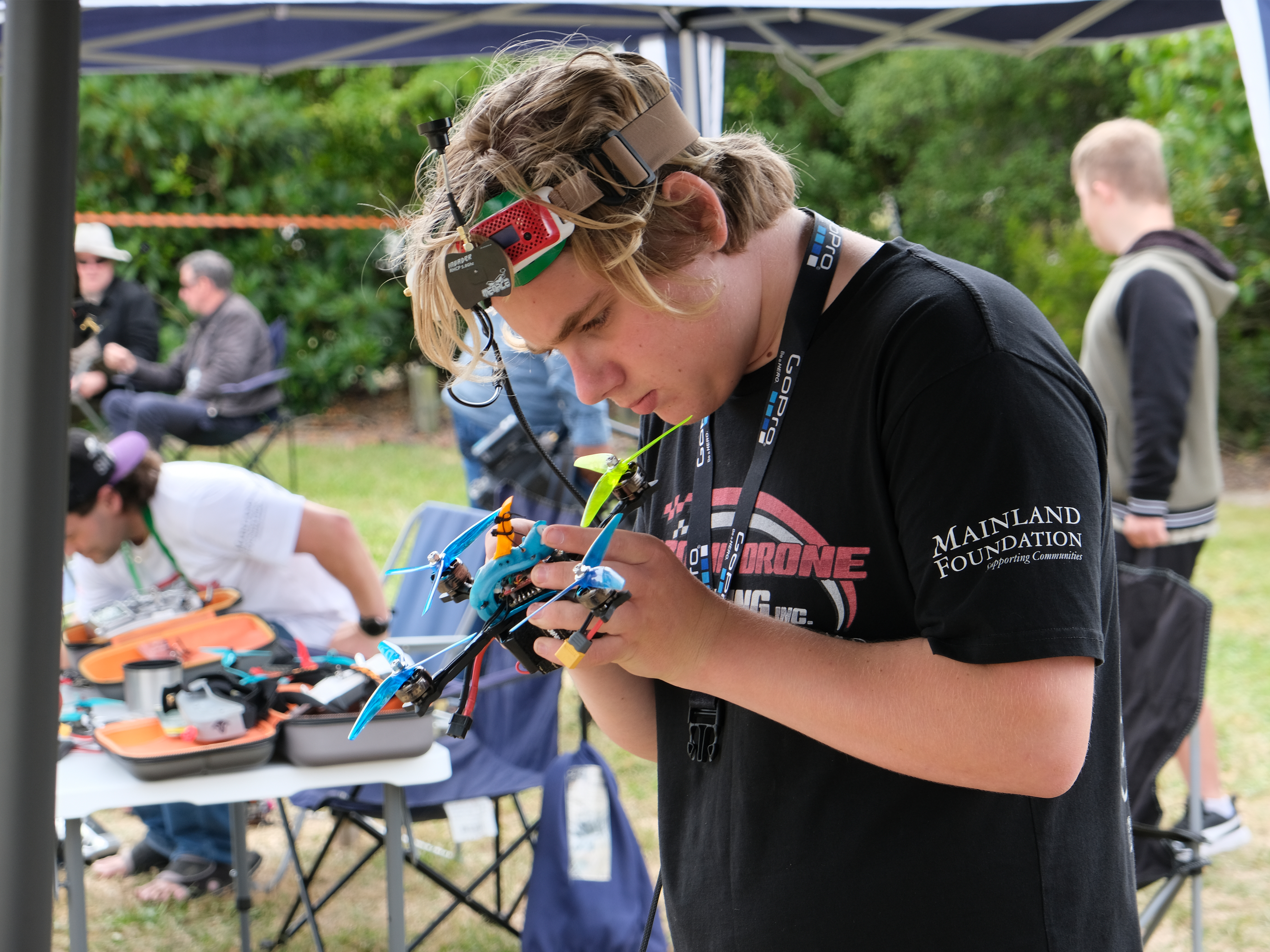 Pilot inspecting drone